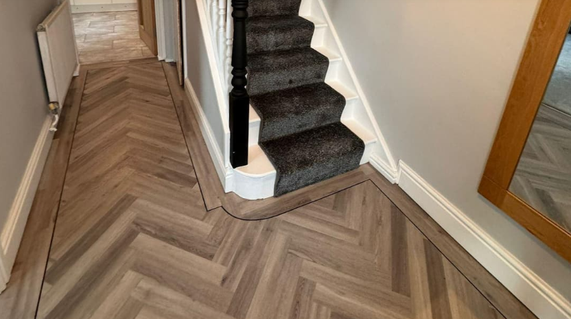 Stair carpet with herringbone hallway flooring
